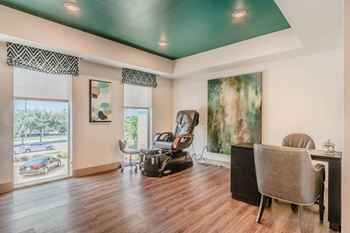 A room with a green ceiling and a chair.